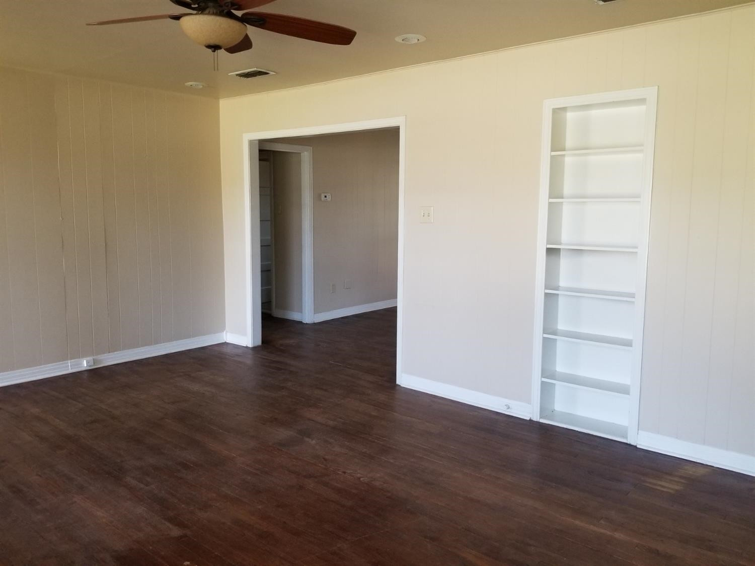 2621 27th Street Lubbock, TX 79410 - Photo 3 of 6 a view of an empty room with wooden floor