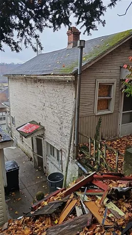 a front view of a house with parking