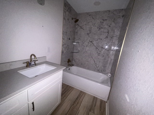 807 Erin Street El Campo, TX 77437 - Photo 12 of 13 a bathroom with a sink and a mirror