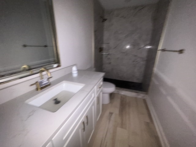 807 Erin Street El Campo, TX 77437 - Photo 10 of 13 a bathroom with a sink a toilet and a shower