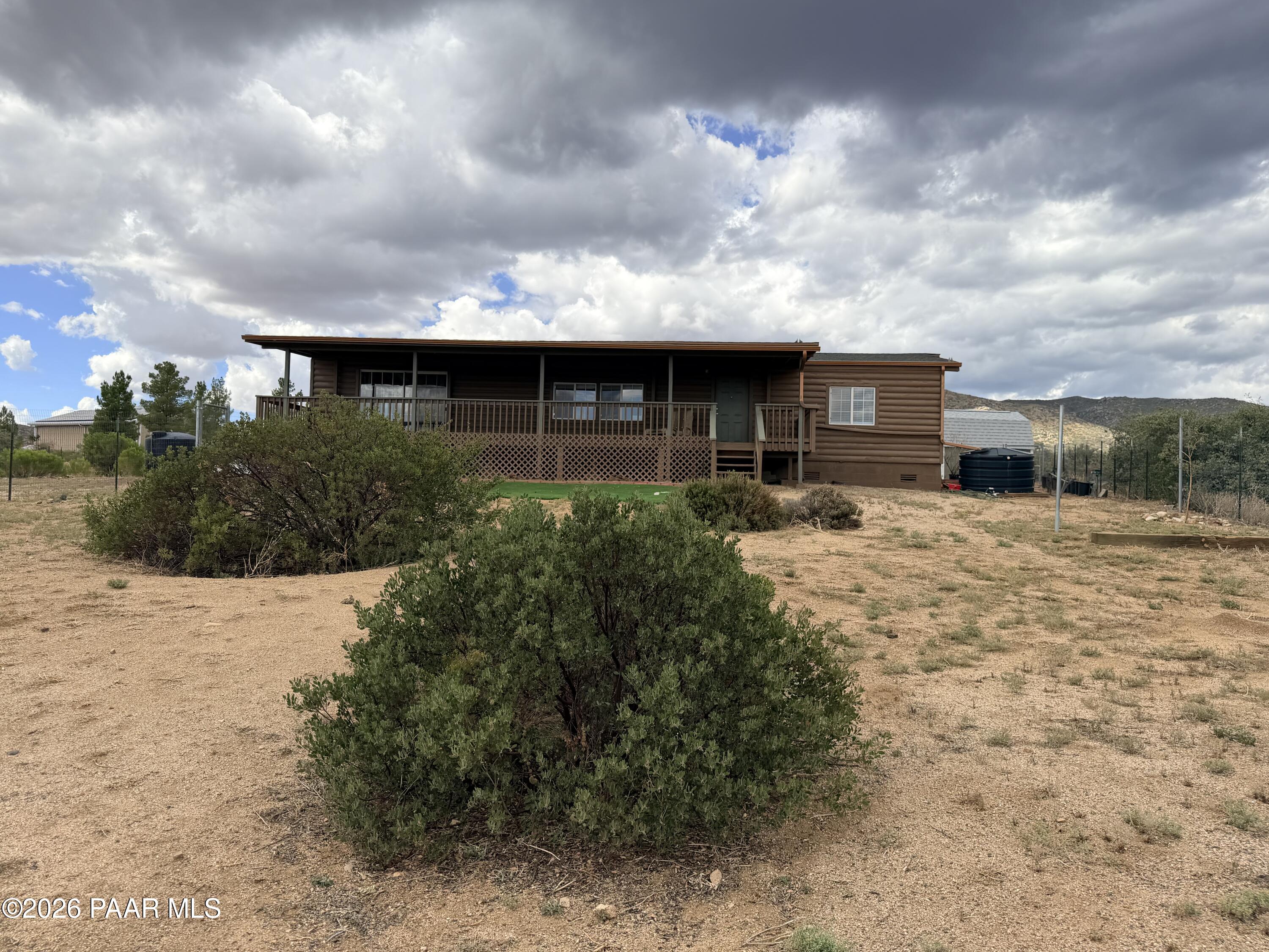 1675 Ark Landing, Unit 8 Dewey, AZ 86327 - Photo 1 of 35 Front Deck with Landscaping