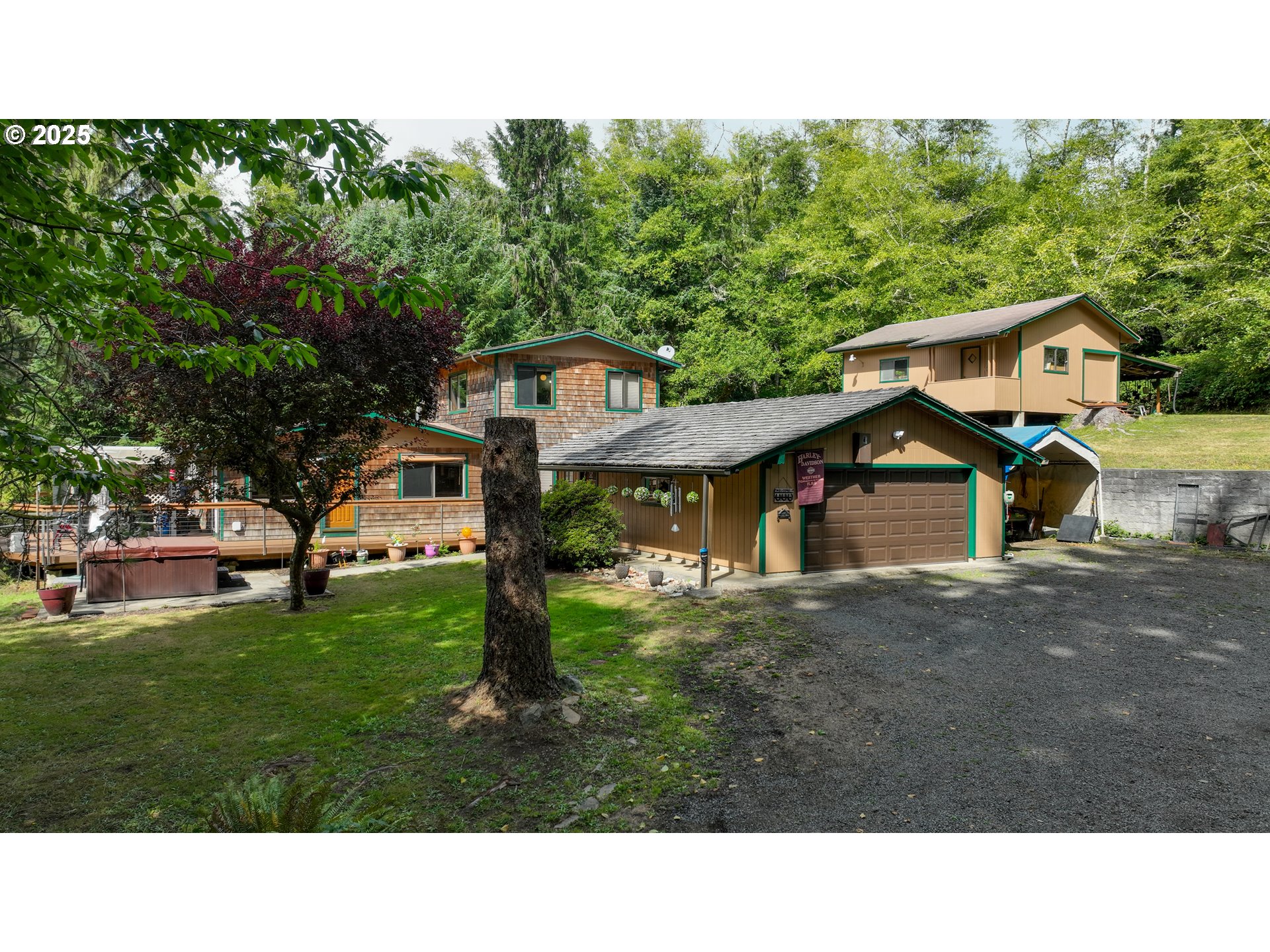 89869 Highway 202 Astoria, OR 97103 - Photo 1 of 30 a backyard of a house with table and chairs