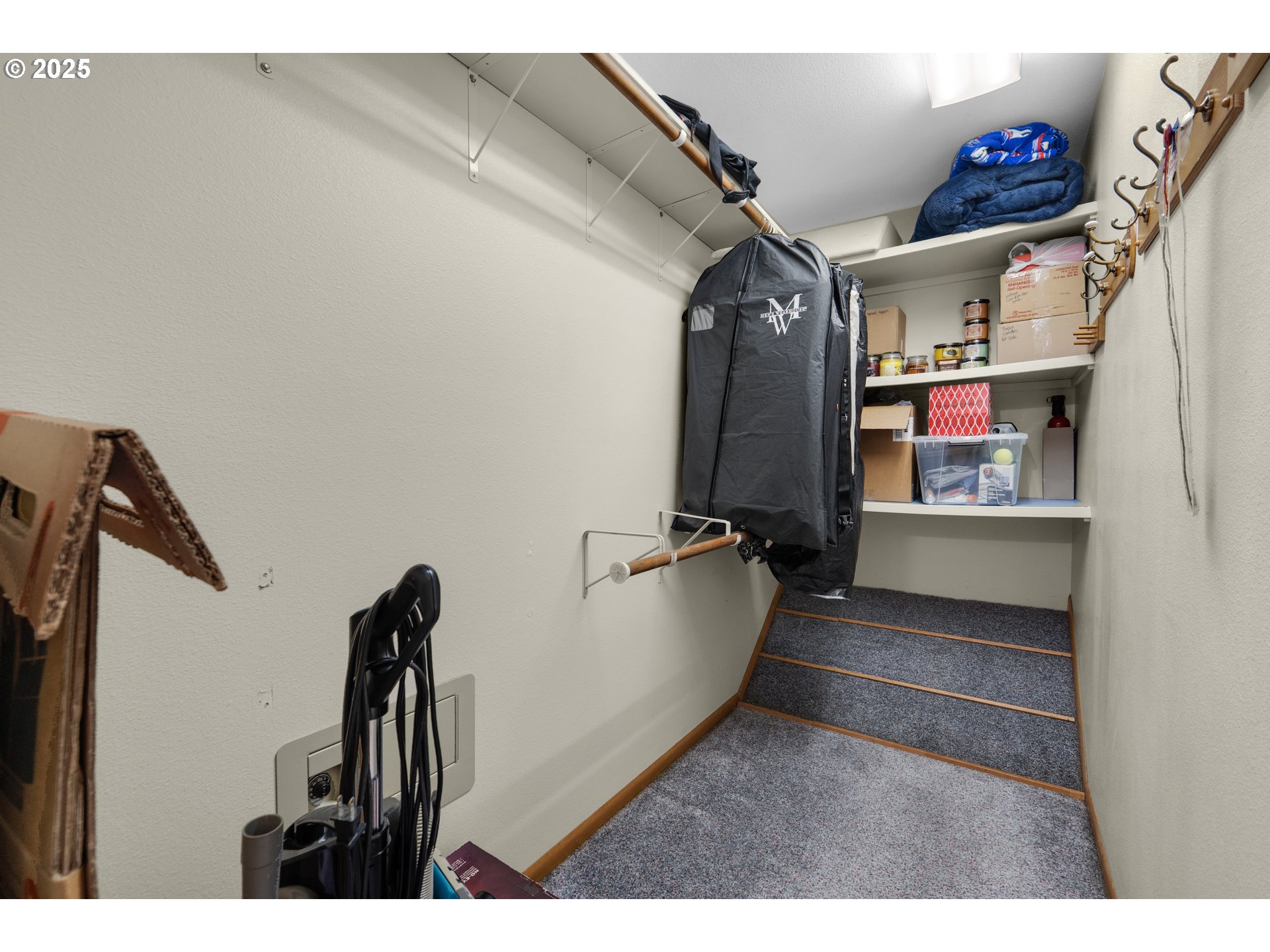 89869 Highway 202 Astoria, OR 97103 - Photo 24 of 30 a view of walk in closet with clothes and shoes