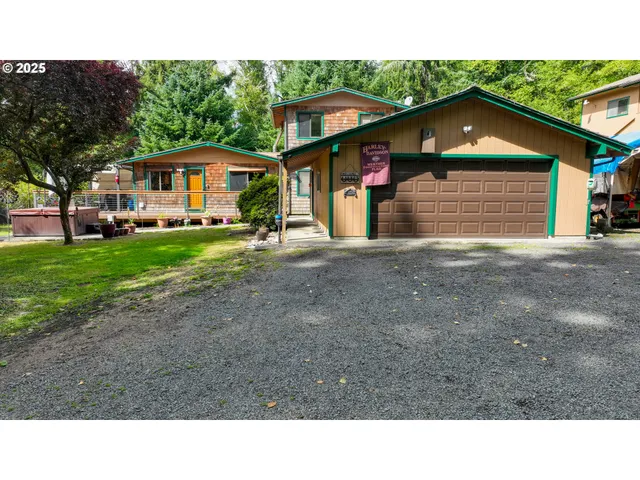 a black and white house with a yard