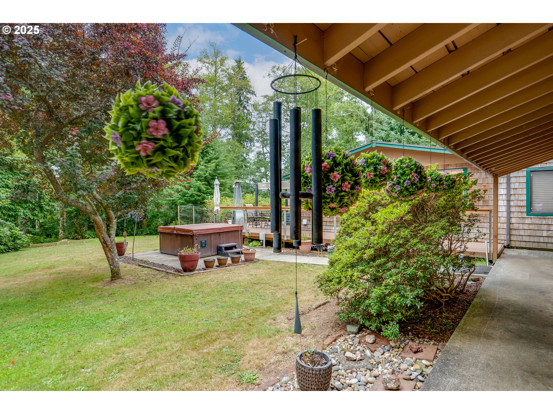 89869 Highway 202 Astoria, OR 97103 - Photo 4 of 30 a couple of flower plants sitting in front of a house