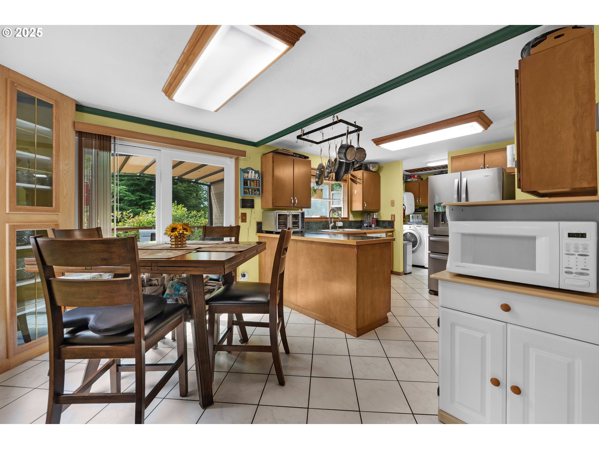 89869 Highway 202 Astoria, OR 97103 - Photo 9 of 30 a open kitchen with a table and chairs