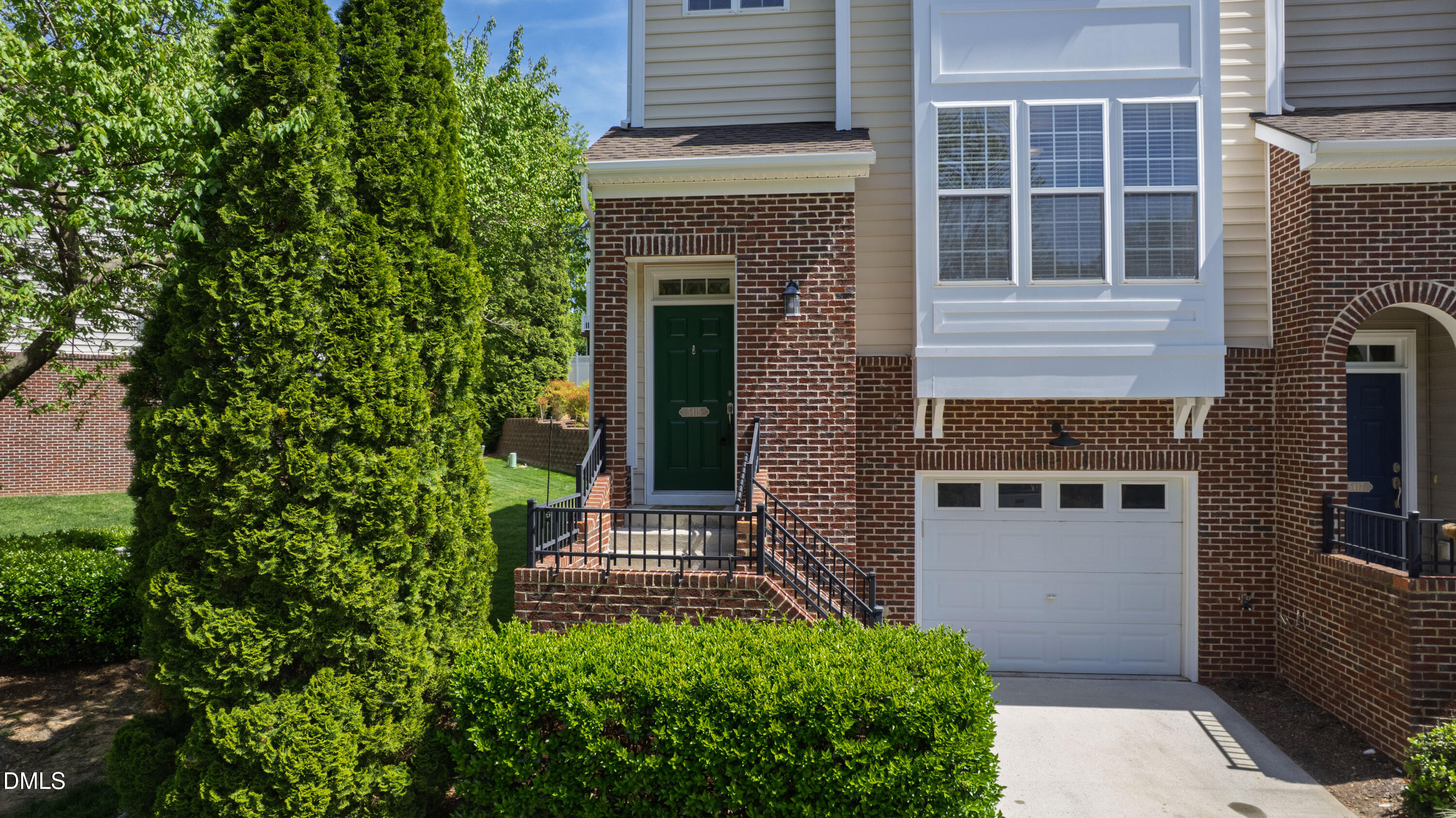 5415 Crescentview Parkway Raleigh, NC 27606 - Photo 11 of 64 a view of a house with brick walls and a small yard