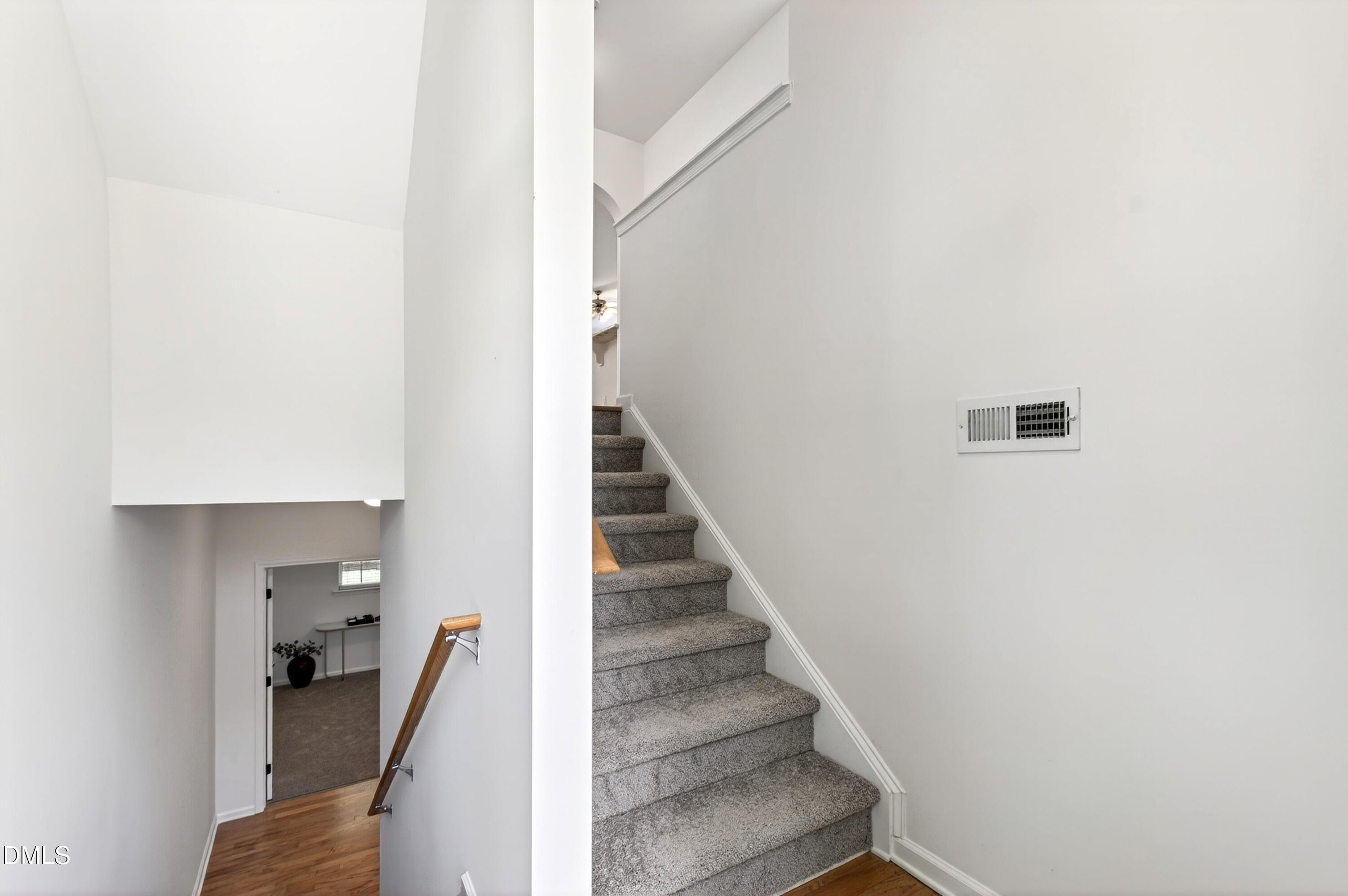 5415 Crescentview Parkway Raleigh, NC 27606 - Photo 14 of 64 a view of a hallway with staircase