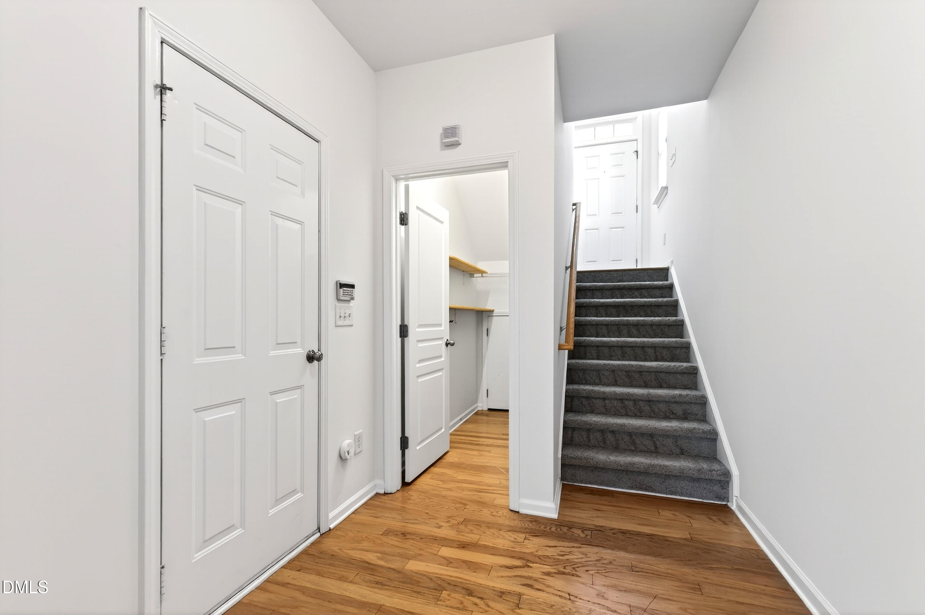 5415 Crescentview Parkway Raleigh, NC 27606 - Photo 15 of 64 a view of a hallway with wooden floor and entryway