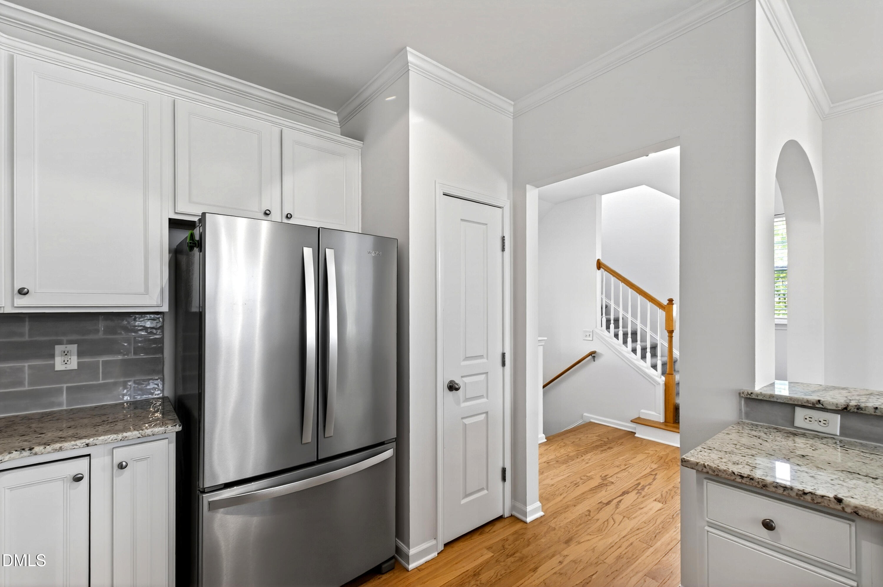 5415 Crescentview Parkway Raleigh, NC 27606 - Photo 27 of 64 a kitchen with granite countertop a refrigerator and a sink