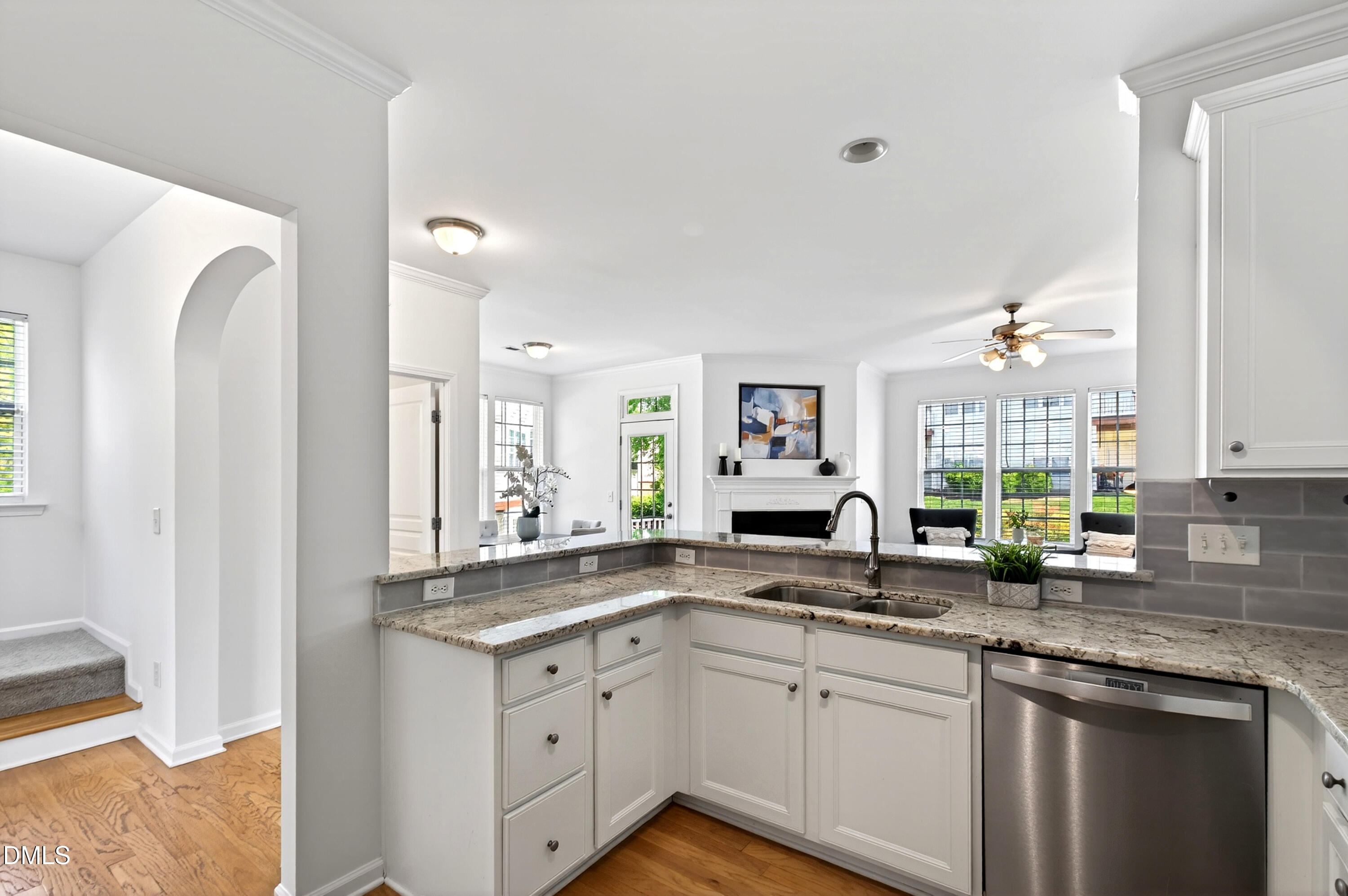 5415 Crescentview Parkway Raleigh, NC 27606 - Photo 28 of 64 a kitchen with stainless steel appliances granite countertop a sink stove and cabinets