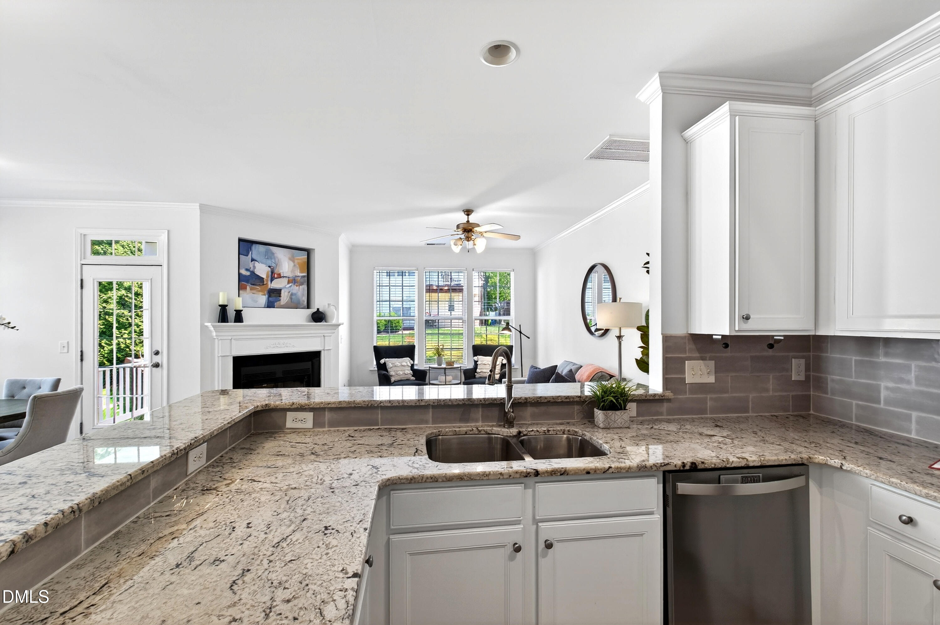 5415 Crescentview Parkway Raleigh, NC 27606 - Photo 29 of 64 a kitchen with granite countertop a sink and a stove top oven