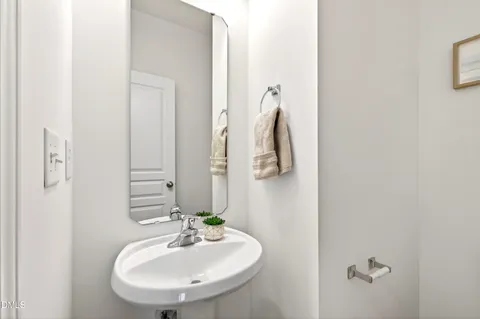 a view of a closet area with ceiling fan
