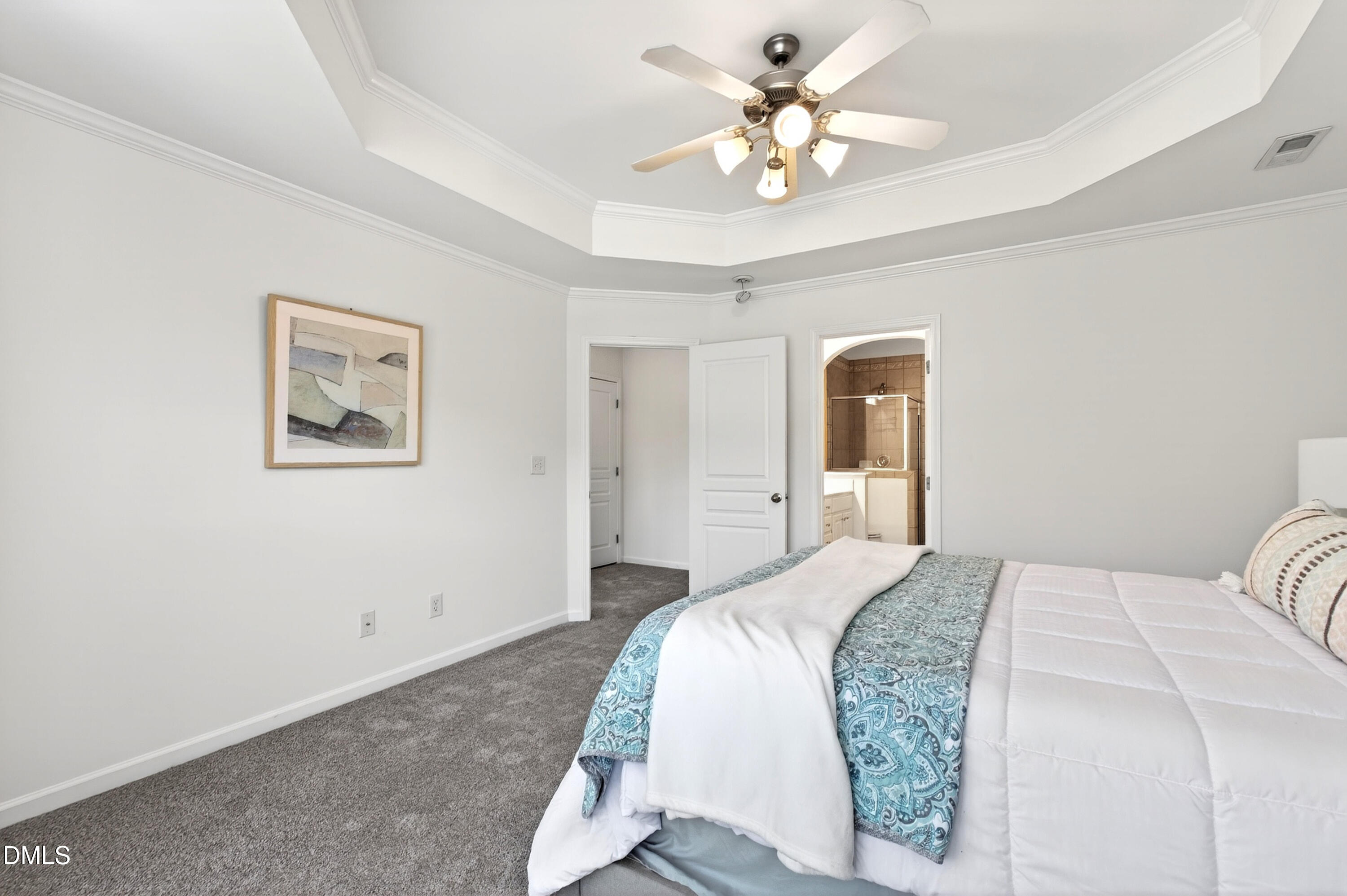 5415 Crescentview Parkway Raleigh, NC 27606 - Photo 41 of 64 a bedroom with a bed and a chandelier