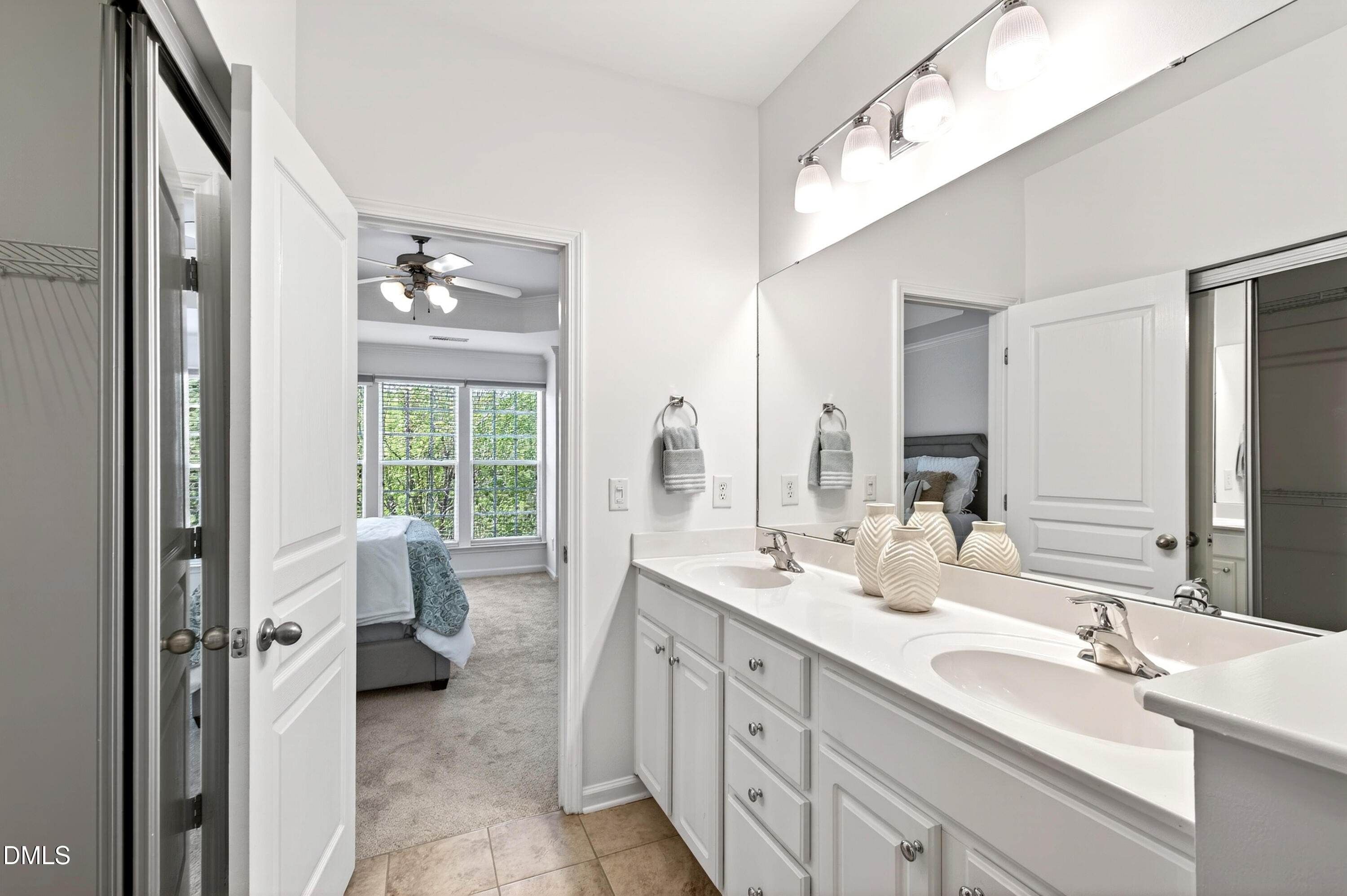 5415 Crescentview Parkway Raleigh, NC 27606 - Photo 42 of 64 a bathroom with a double vanity sink mirror and