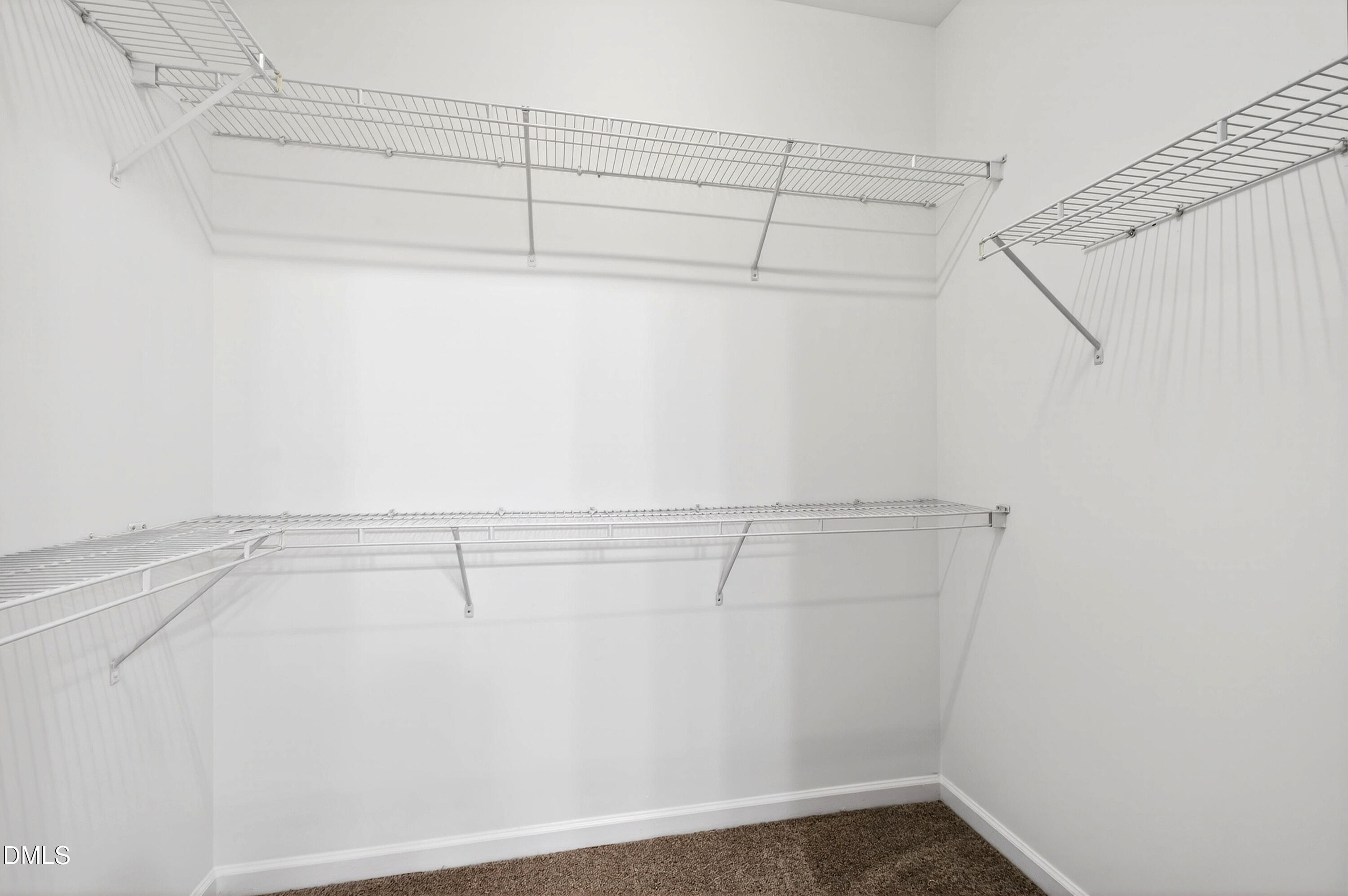 5415 Crescentview Parkway Raleigh, NC 27606 - Photo 45 of 64 a view of a room with racks on the wall