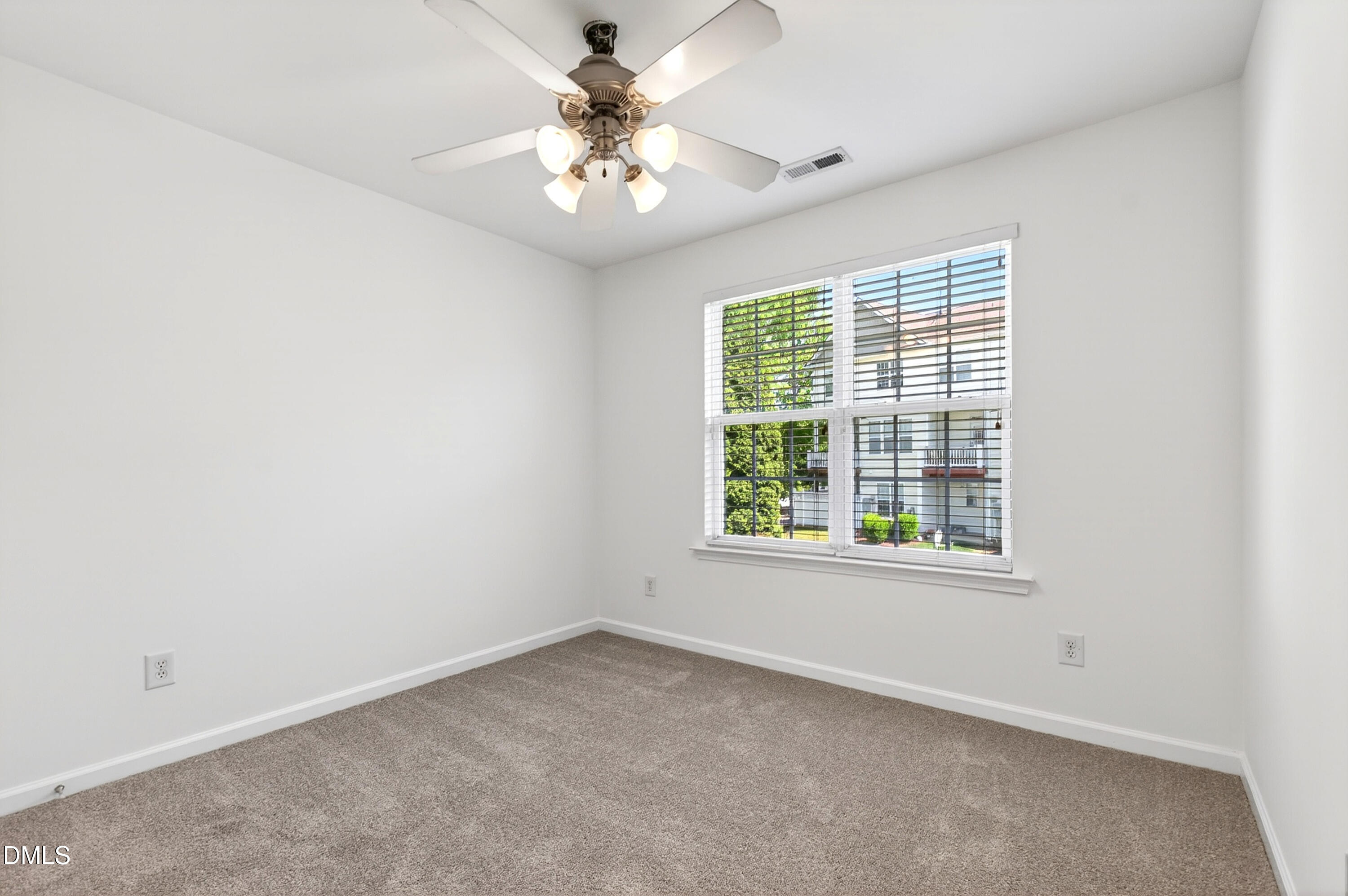5415 Crescentview Parkway Raleigh, NC 27606 - Photo 48 of 64 an empty room with a window