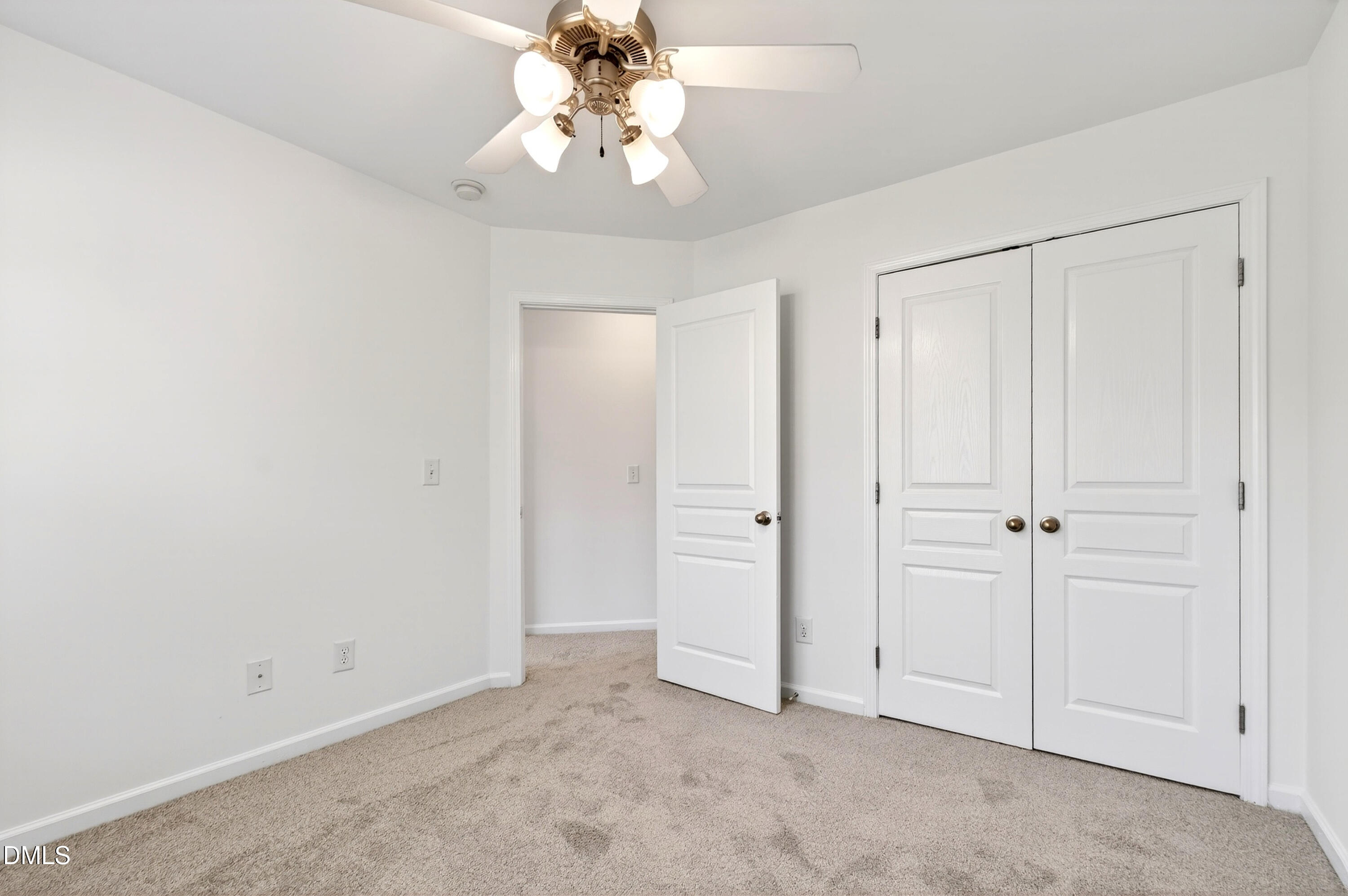 5415 Crescentview Parkway Raleigh, NC 27606 - Photo 49 of 64 an empty room with a chandelier fan