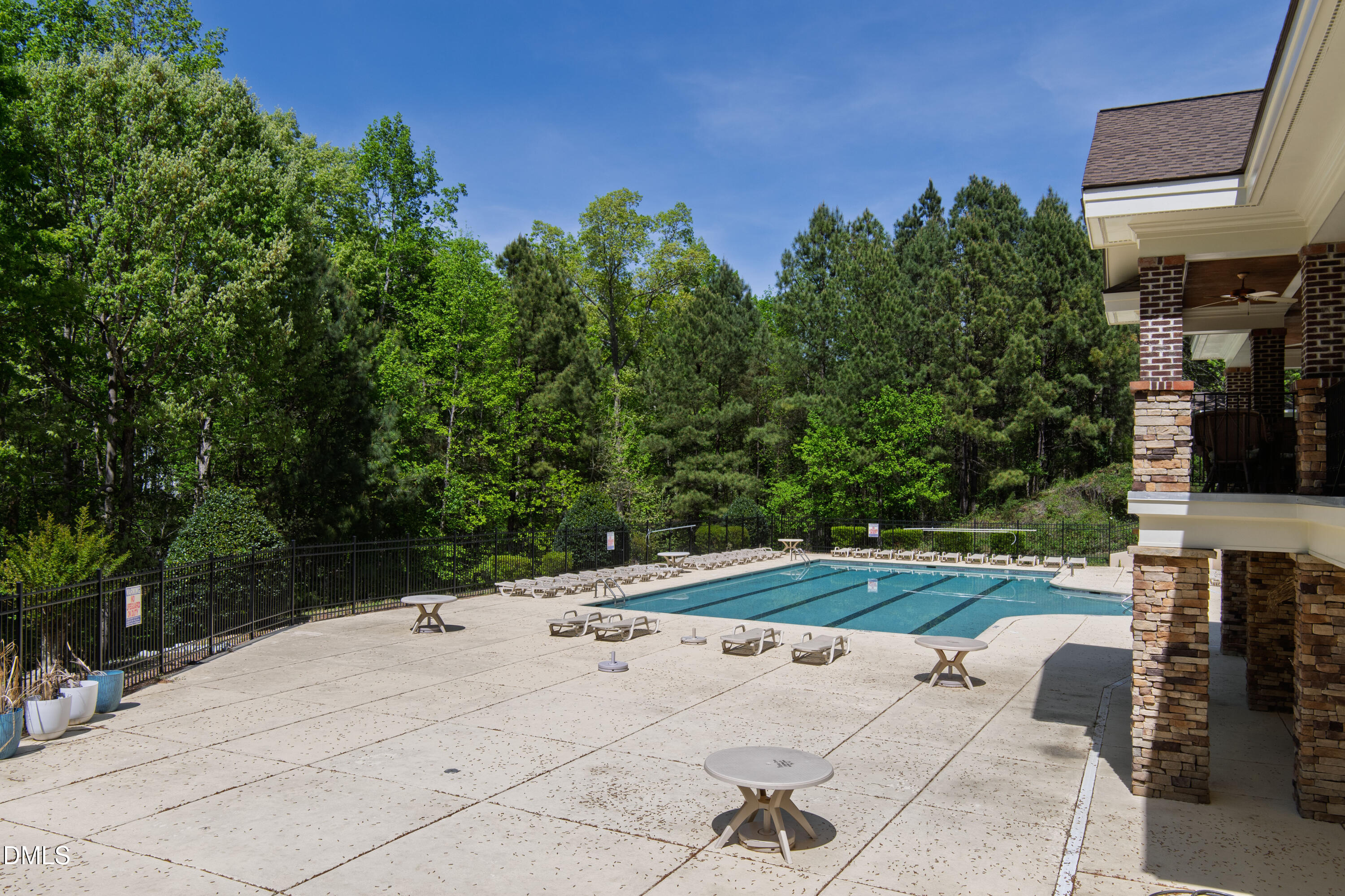 5415 Crescentview Parkway Raleigh, NC 27606 - Photo 53 of 64 a backyard of a house with lots of green space and trees in the background