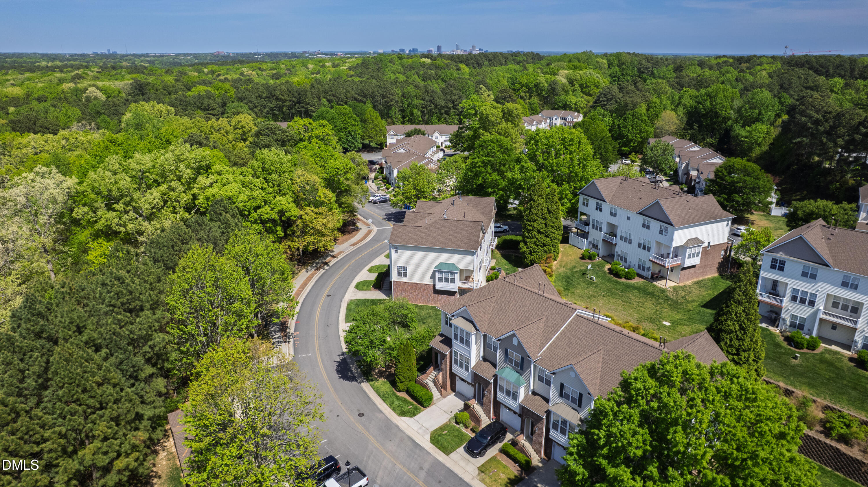5415 Crescentview Parkway Raleigh, NC 27606 - Photo 59 of 64 an aerial view of a house with garden space and street view