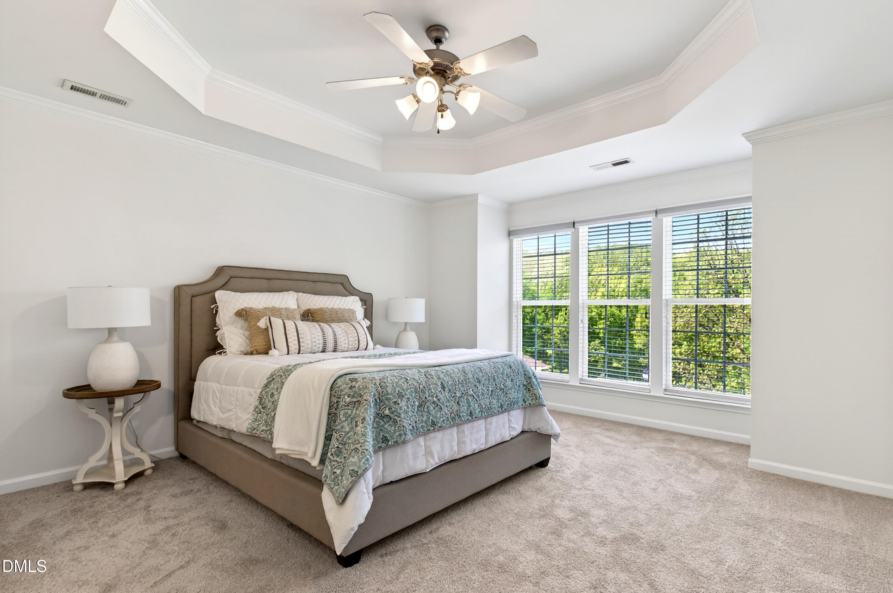 5415 Crescentview Parkway Raleigh, NC 27606 - Photo 5 of 64 a spacious bedroom with a bed and a chandelier