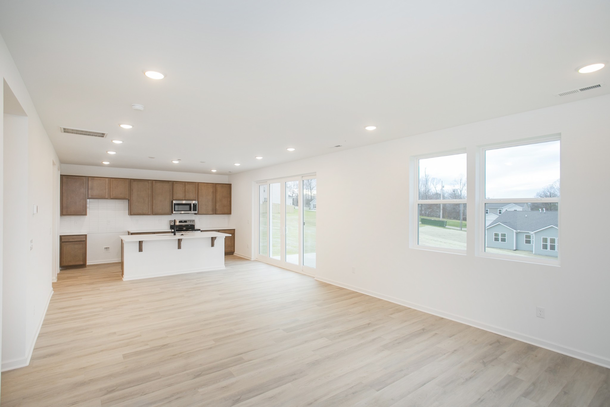 711 Chestnut Bend Dickson, TN 37055 - Photo 11 of 29 a view of kitchen with wooden floor and windows