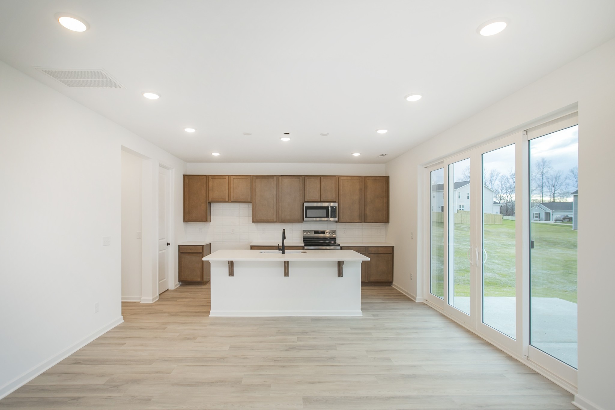 711 Chestnut Bend Dickson, TN 37055 - Photo 17 of 29 a view of a kitchen with a sink and a refrigerator