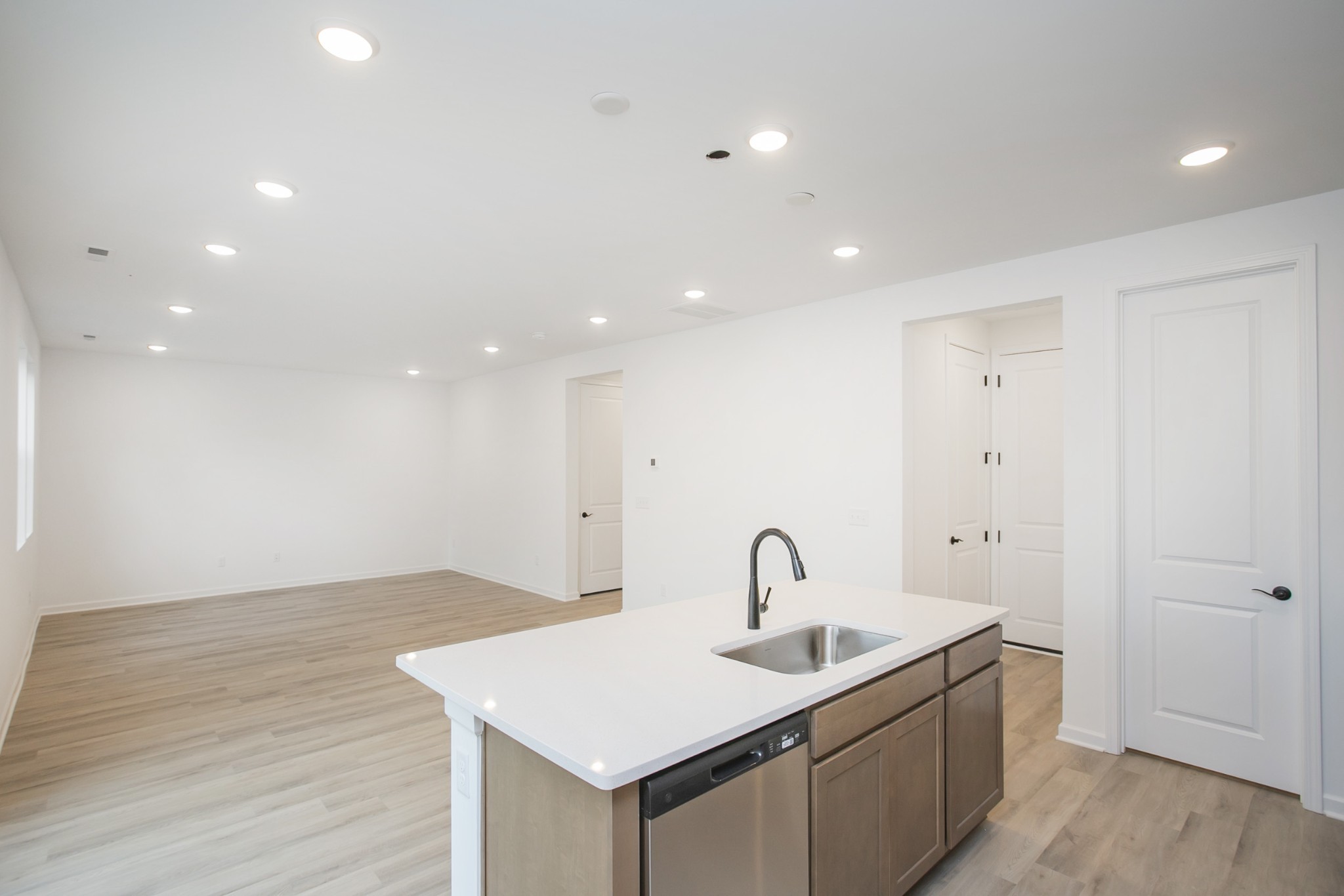 711 Chestnut Bend Dickson, TN 37055 - Photo 20 of 29 a kitchen with a sink stainless steel appliances and wooden floor
