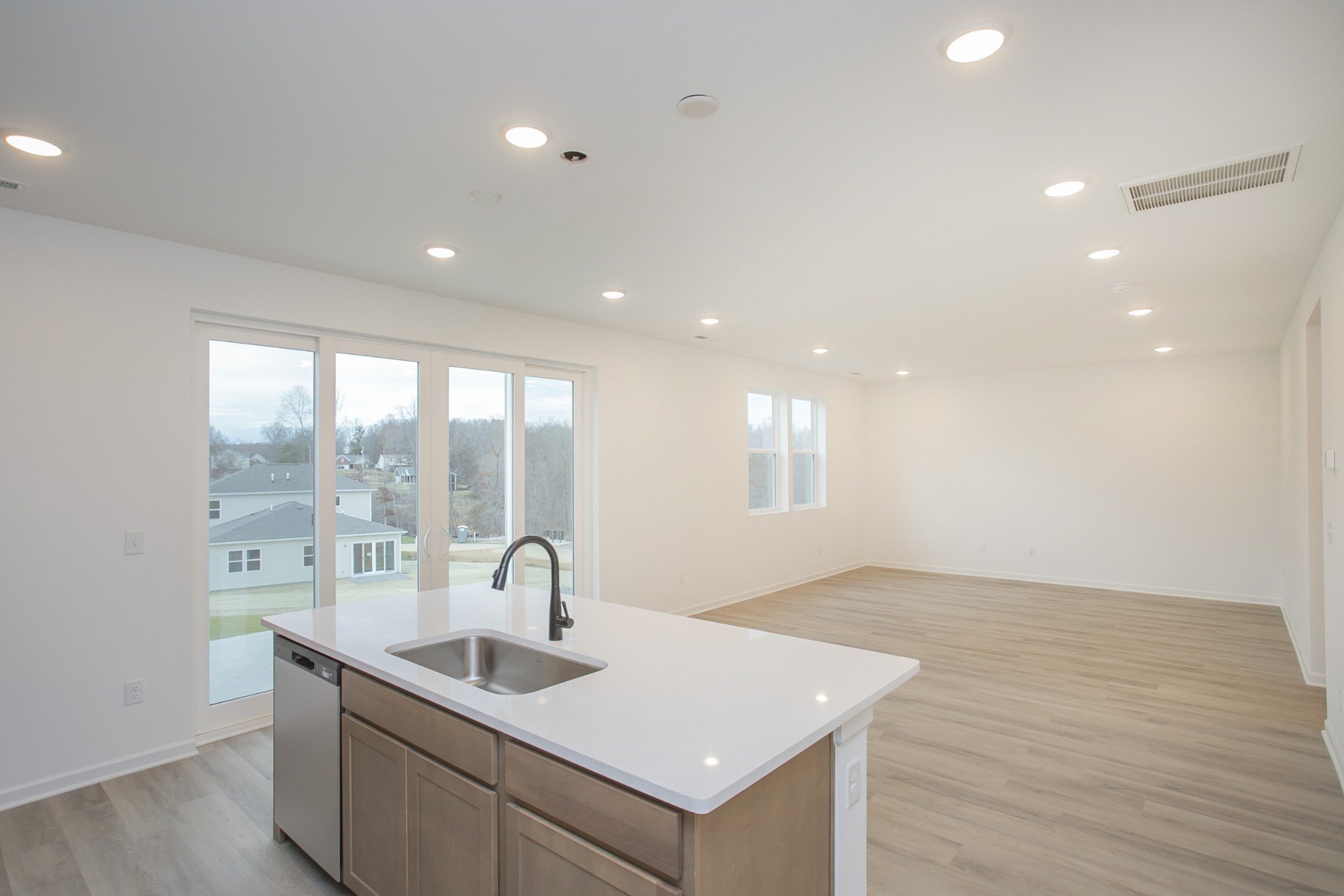711 Chestnut Bend Dickson, TN 37055 - Photo 21 of 29 a view of kitchen with a sink and dishwasher with wooden floor