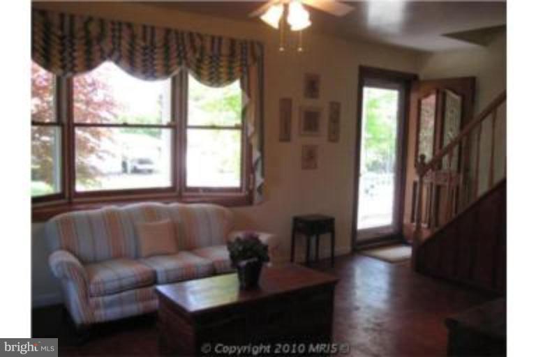 727 Cliffedge Road Pikesville, MD 21208 - Photo 3 of 14 a living room with furniture and a window