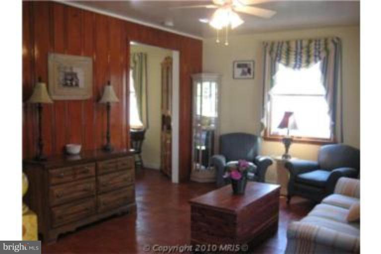 727 Cliffedge Road Pikesville, MD 21208 - Photo 4 of 14 a living room with furniture and a window