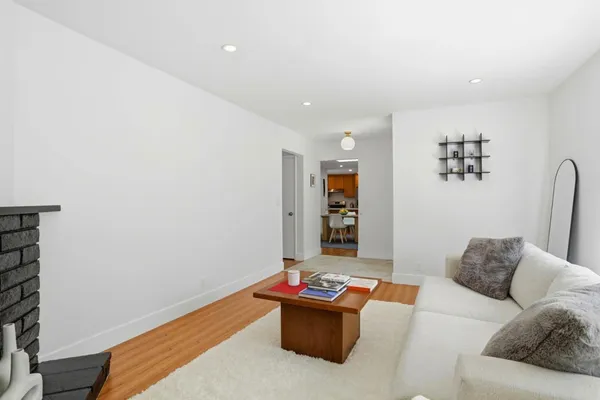 a bedroom with a bed and a chair