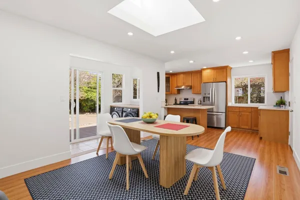 a dining room with furniture and window