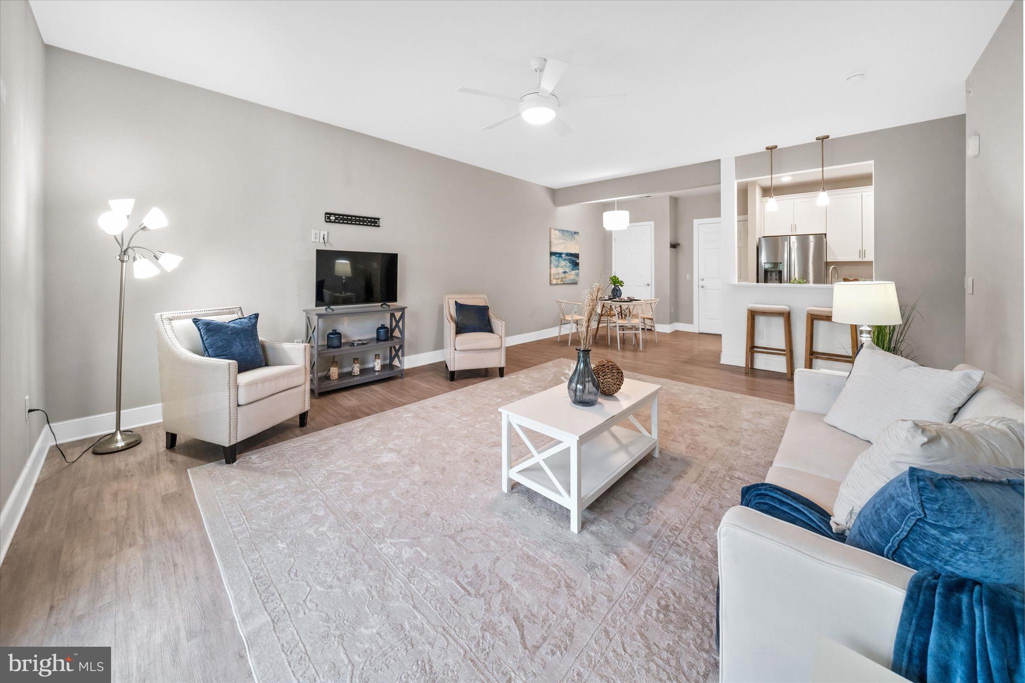 30609 Cedar Neck Road, Unit 3205 Ocean View, DE 19970 - Photo 13 of 28 a living room with furniture and a flat screen tv