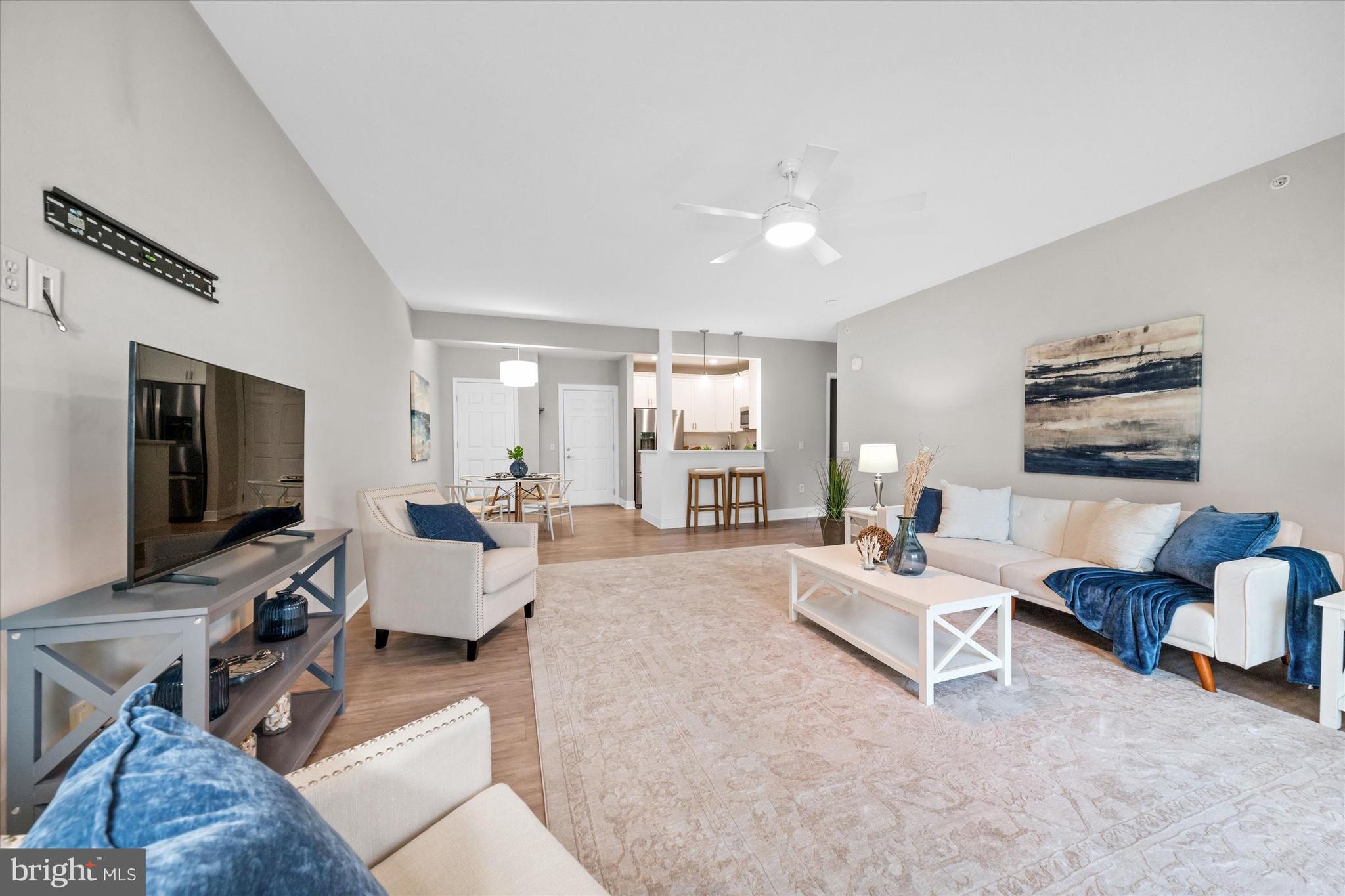 30609 Cedar Neck Road, Unit 3205 Ocean View, DE 19970 - Photo 14 of 28 a living room with furniture and a flat screen tv