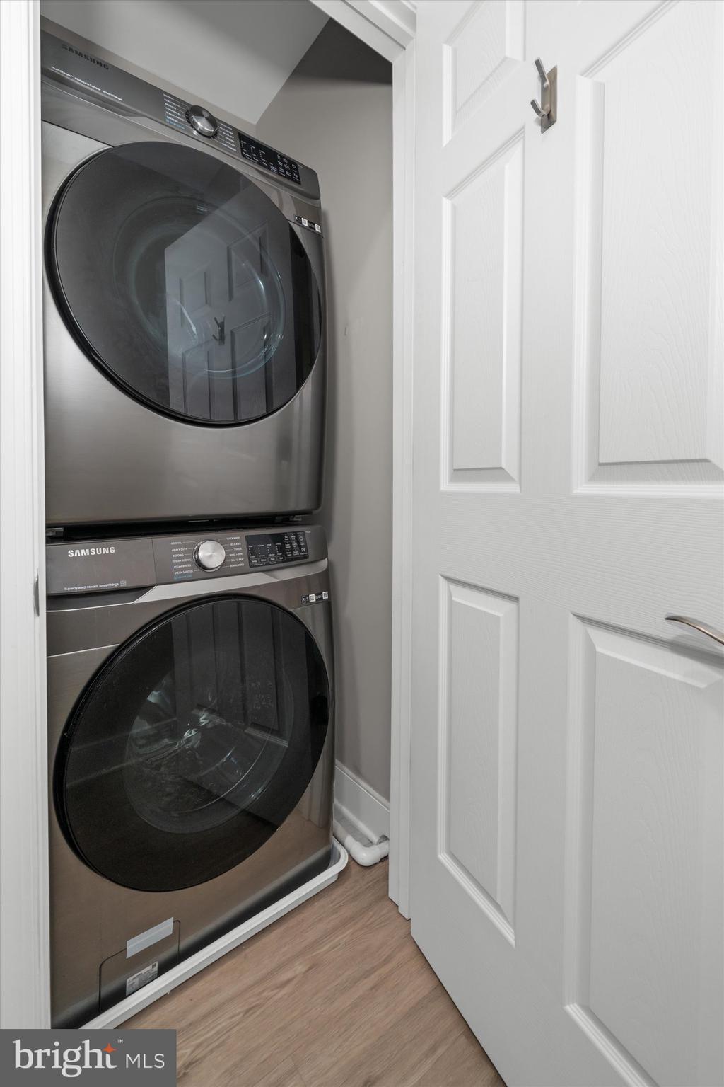 30609 Cedar Neck Road, Unit 3205 Ocean View, DE 19970 - Photo 17 of 28 a utility room with wooden floor and mirror