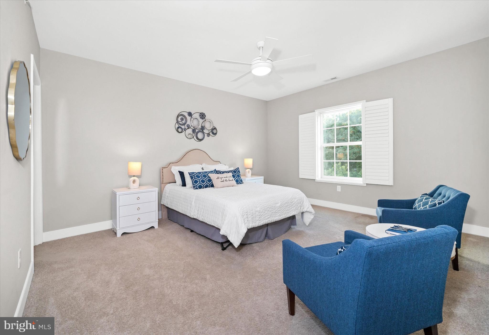 30609 Cedar Neck Road, Unit 3205 Ocean View, DE 19970 - Photo 18 of 28 a bed room with a bed and a couch