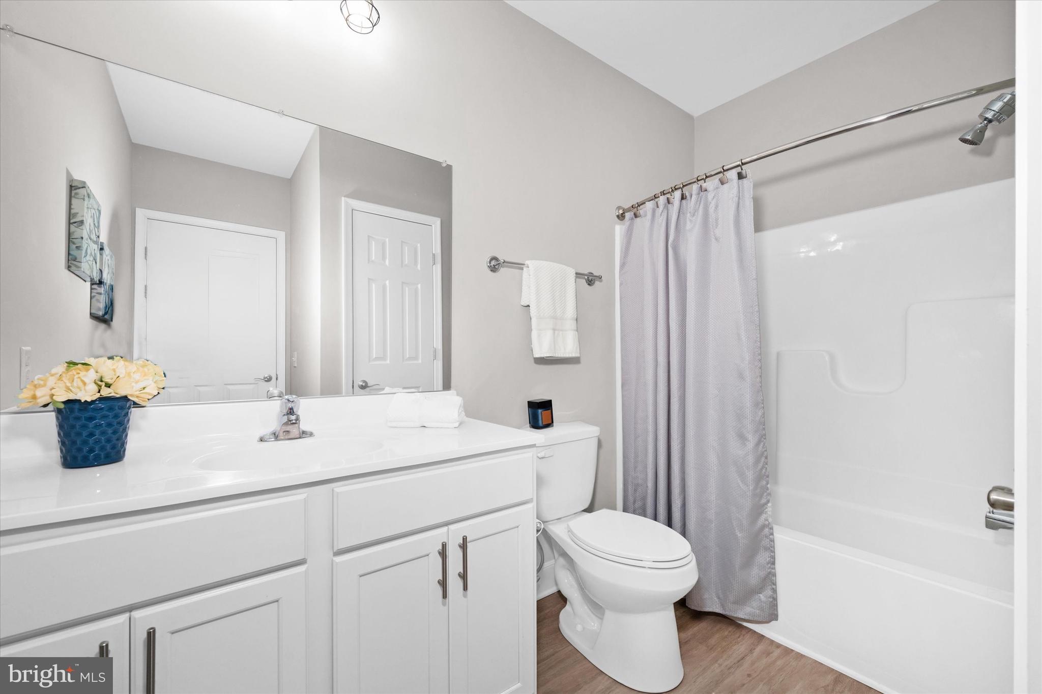30609 Cedar Neck Road, Unit 3205 Ocean View, DE 19970 - Photo 24 of 28 a bathroom with a sink toilet and shower