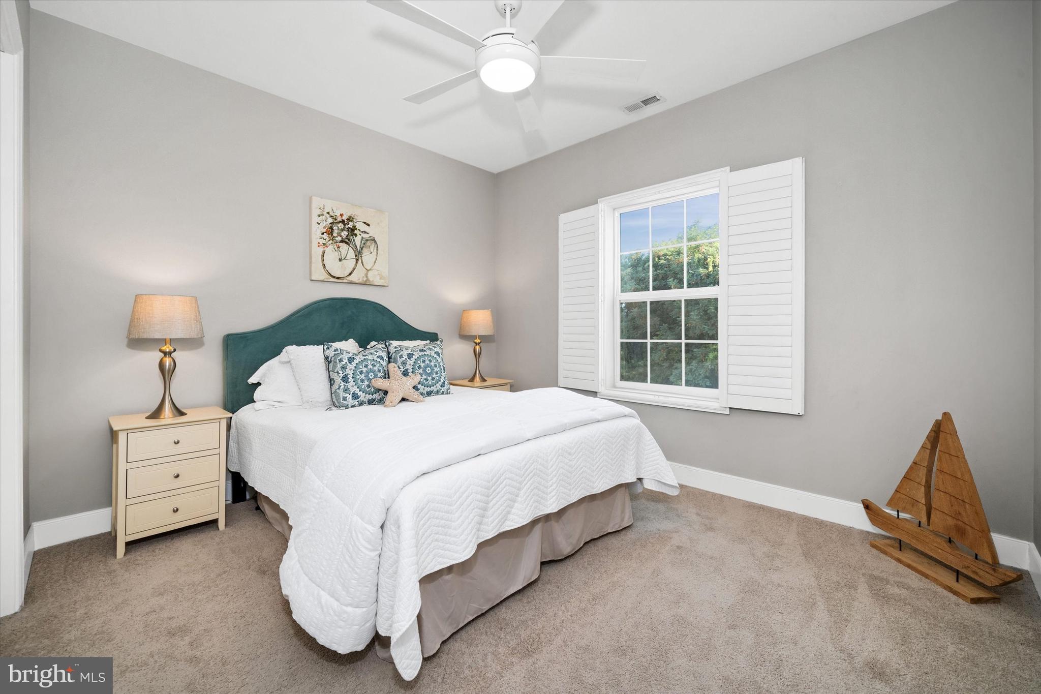 30609 Cedar Neck Road, Unit 3205 Ocean View, DE 19970 - Photo 25 of 28 a bedroom with a bed and a window