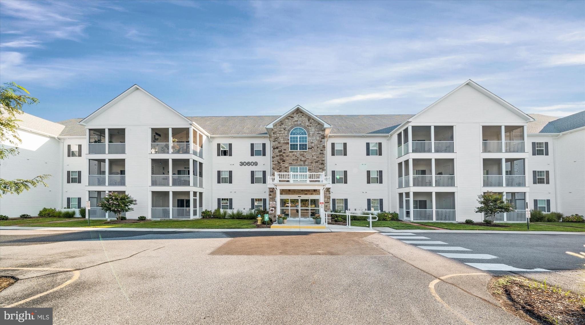 30609 Cedar Neck Road, Unit 3205 Ocean View, DE 19970 - Photo 3 of 28 a front view of building with a yard
