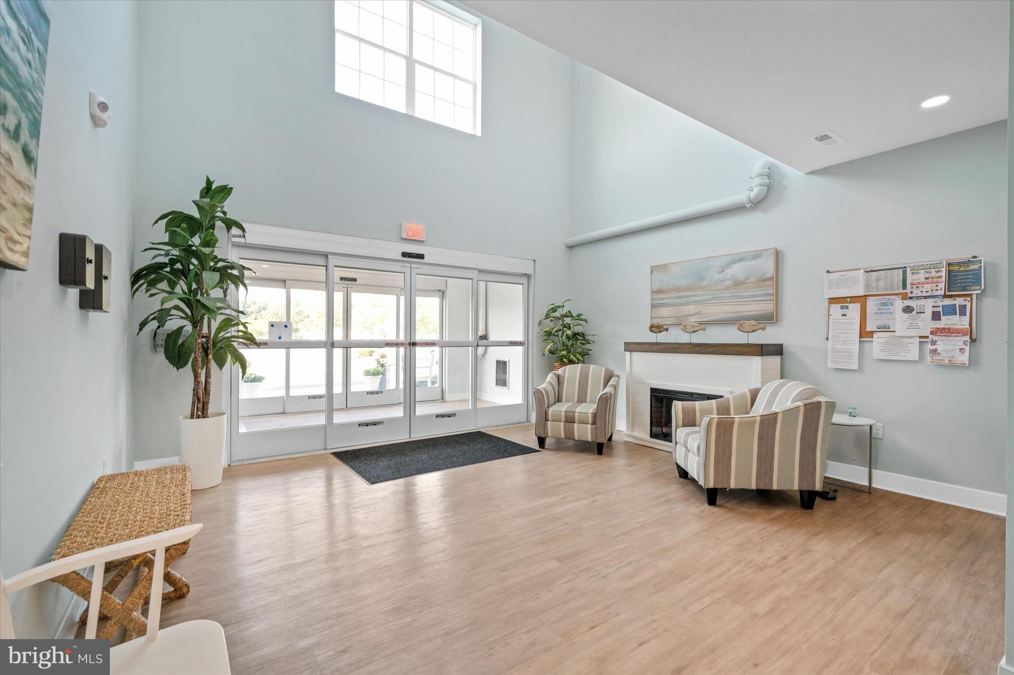 30609 Cedar Neck Road, Unit 3205 Ocean View, DE 19970 - Photo 4 of 28 a living room with furniture and a large window