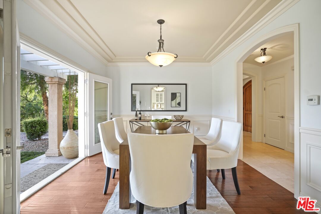 969 Crown Hill Drive Simi Valley, CA 93063 - Photo 12 of 62 a view of a dining room with furniture window and wooden floor