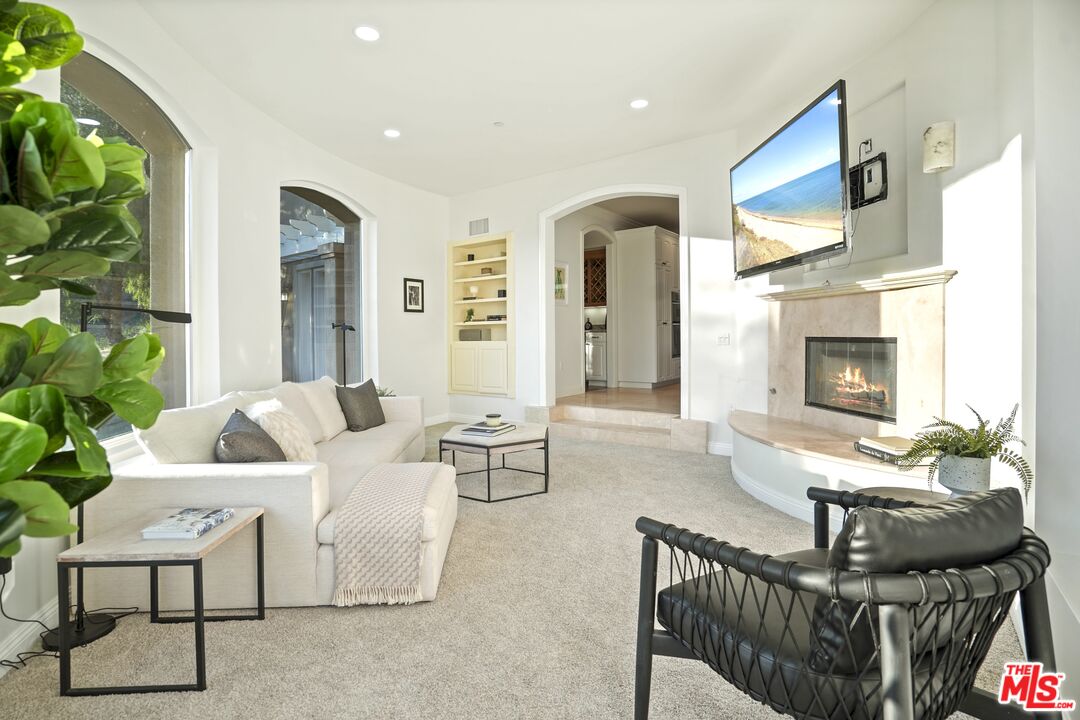969 Crown Hill Drive Simi Valley, CA 93063 - Photo 17 of 62 a living room with furniture and a fireplace