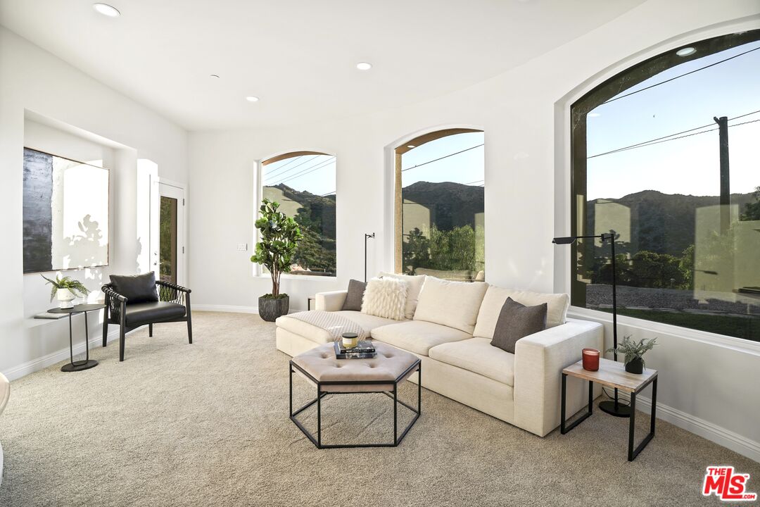 969 Crown Hill Drive Simi Valley, CA 93063 - Photo 19 of 62 a living room with furniture and a large window