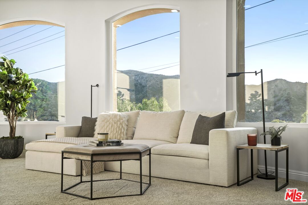 969 Crown Hill Drive Simi Valley, CA 93063 - Photo 20 of 62 a living room with furniture and a large window