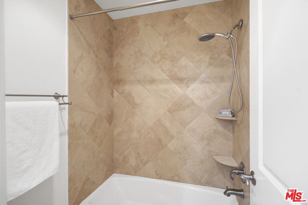 969 Crown Hill Drive Simi Valley, CA 93063 - Photo 24 of 62 a bathroom with a shower and a sink