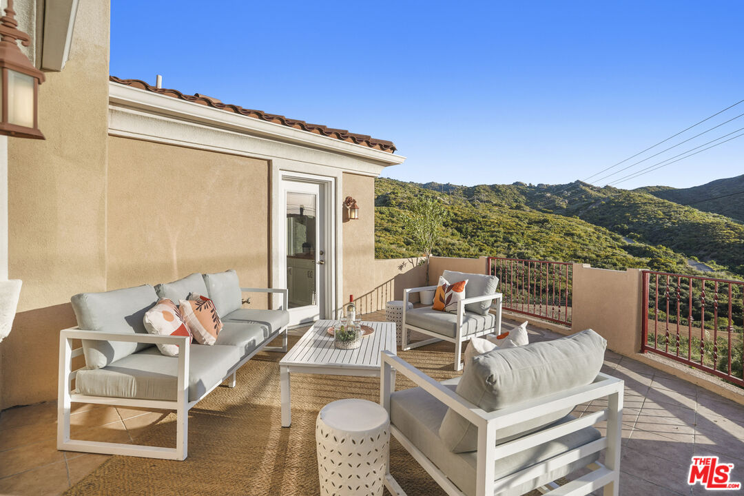 969 Crown Hill Drive Simi Valley, CA 93063 - Photo 36 of 62 a view of a terrace with couches and sky view