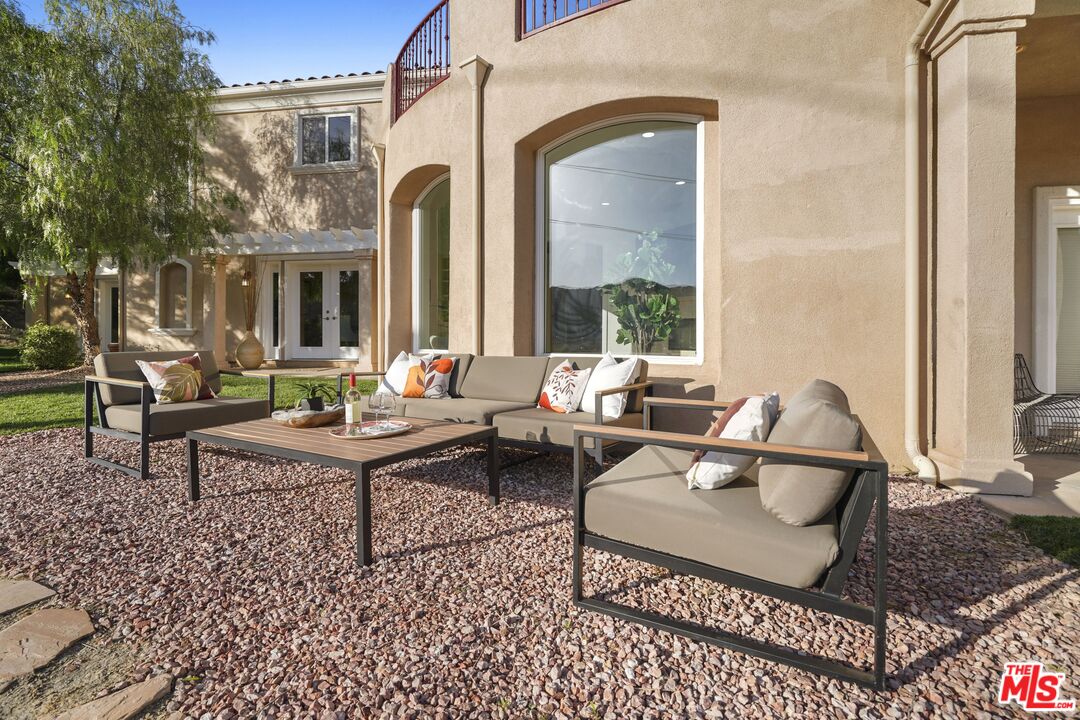 969 Crown Hill Drive Simi Valley, CA 93063 - Photo 40 of 62 a house view with a sitting space and a bench