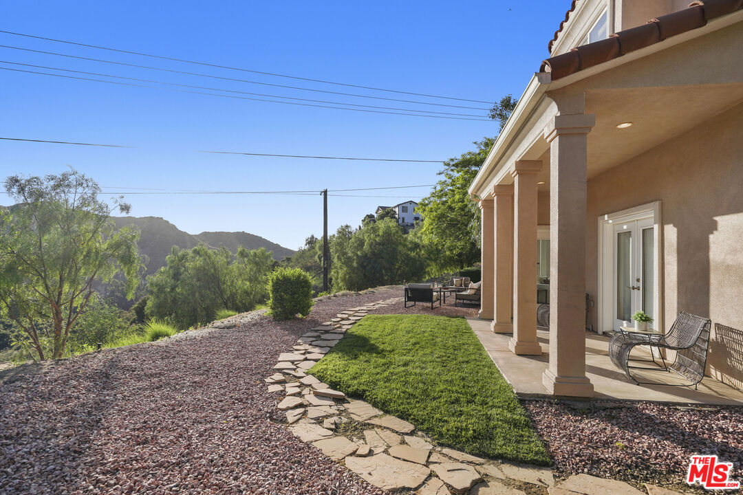 969 Crown Hill Drive Simi Valley, CA 93063 - Photo 41 of 62 a view of a backyard with potted plants