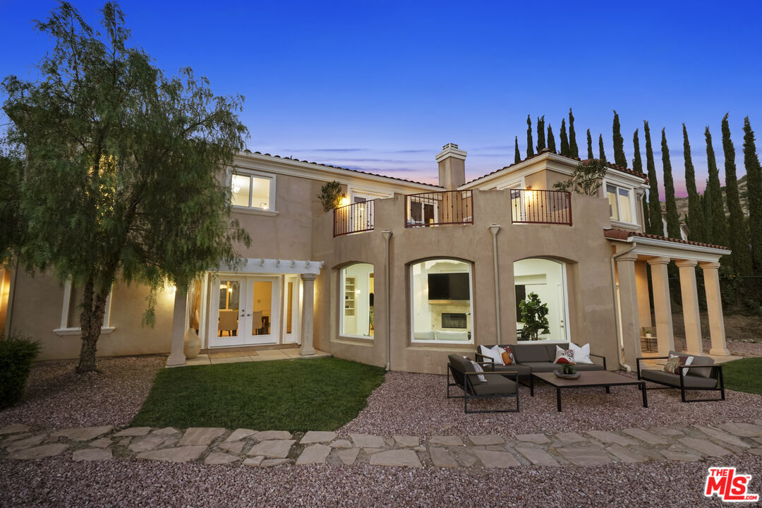 969 Crown Hill Drive Simi Valley, CA 93063 - Photo 49 of 62 a front view of a house with a garden